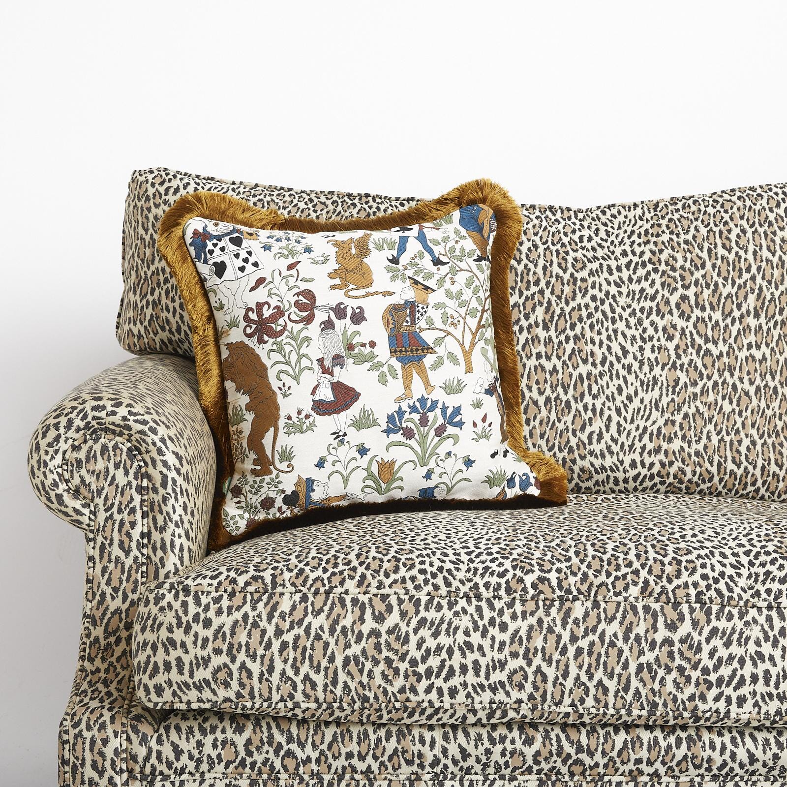 ALICE IN WONDERLAND Medium Fringed Jacquard Cushion - Achillea