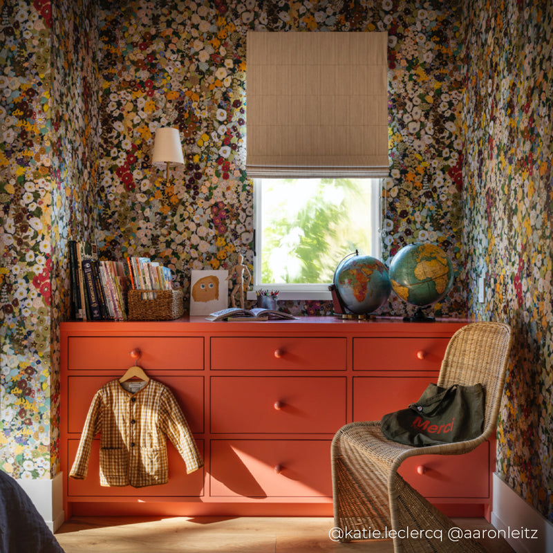 a room with a dresser and a chair