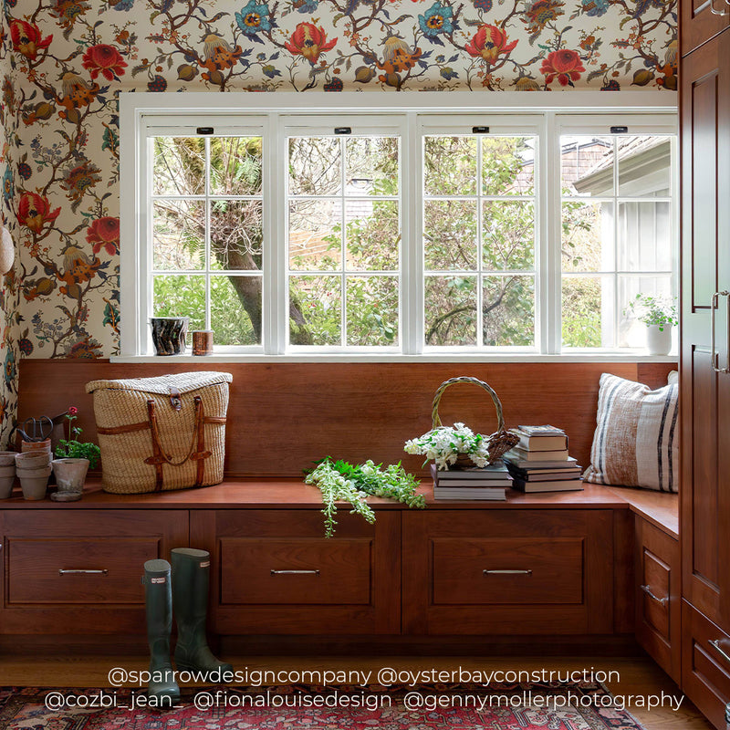a bench with a flower wallpaper and a window