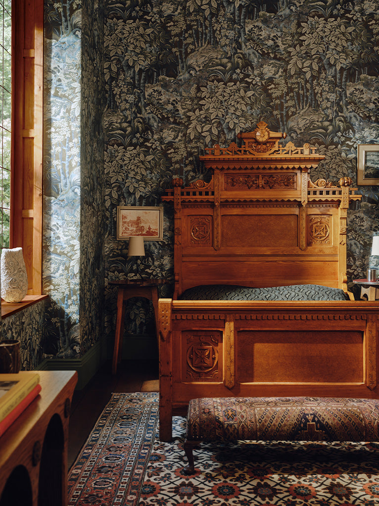a room with a bed and a rug