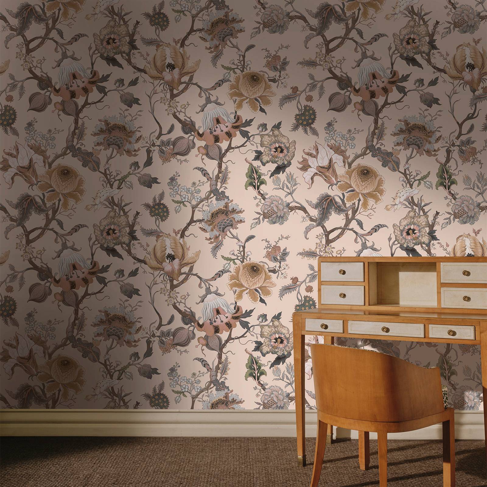 a desk and chair in a room with floral wallpaper