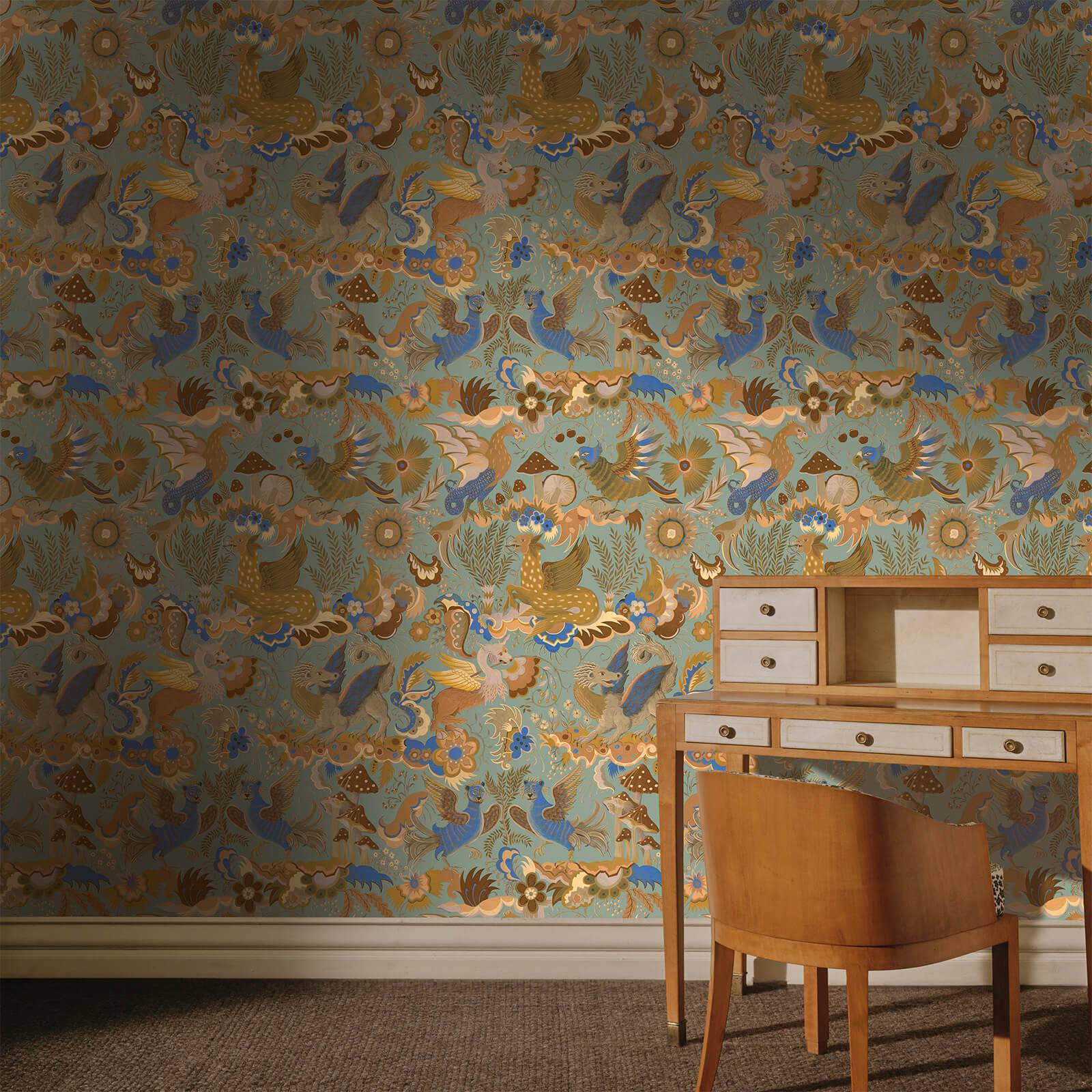 a desk and chair in front of a wallpaper